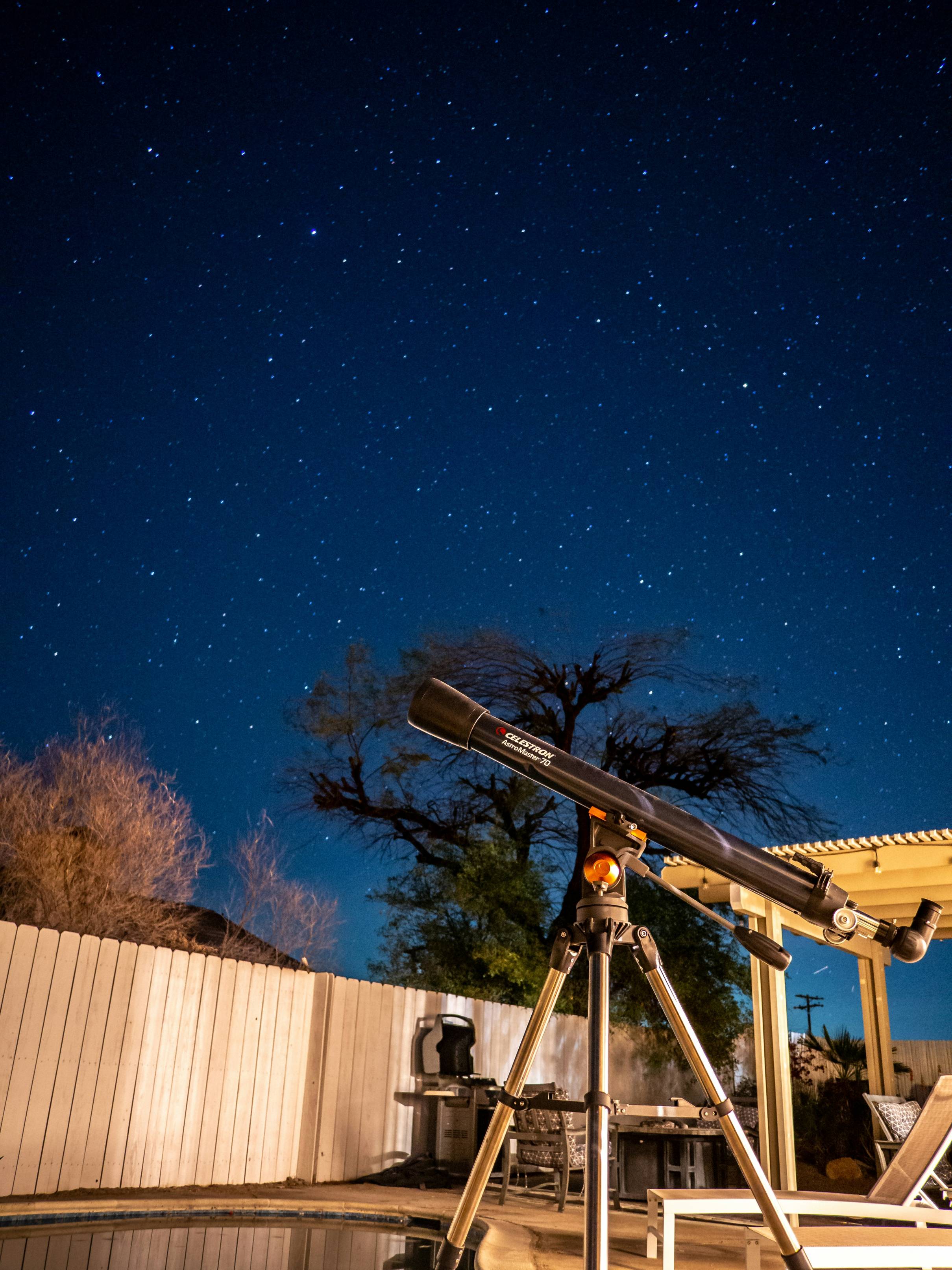 Telescope observes the starry night sky.